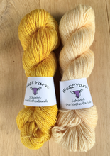 Afbeelding in Gallery-weergave laden, Two skeins of WeStYarn in yellow colorways. Sunshine saffron and Champagne