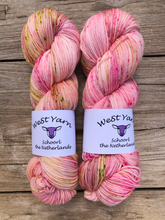 Load image into Gallery viewer, Two luxurious hand-dyed yarn skeins in vibrant apple blossom colorways from WeStYarn, Netherlands. Perfect for premium knitting and crochet projects.
