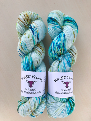 Two luxurious hand-dyed yarn skeins in vibrant aqua colorways from WeStYarn, Netherlands. Perfect for premium knitting and crochet projects.